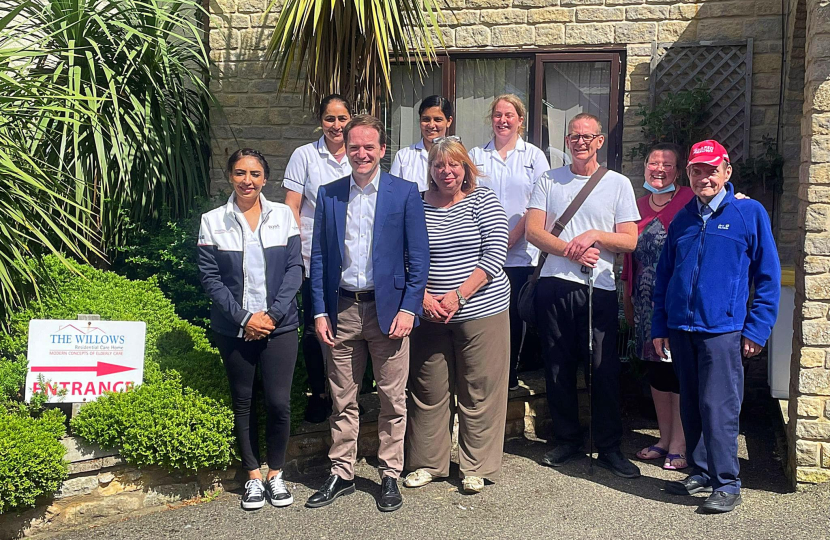 Gareth Davies MP alongside care home staff and owners outside The Willows Care Home