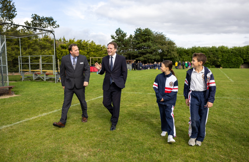 Gareth Davies MP alongside Grantham's Prep's headmaster, head boy, and head girl