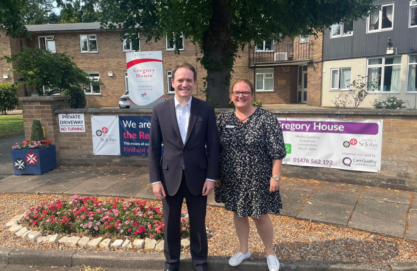 Gareth Davies MP and Marie outside Gregory House