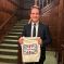 Gareth Davies MP holding a bag reading 'Back British Farming'