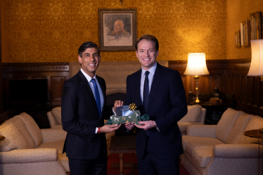 Gareth Davies MP with the Prime Minister holding the present