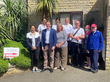 Gareth Davies MP alongside care home staff and owners outside The Willows Care Home