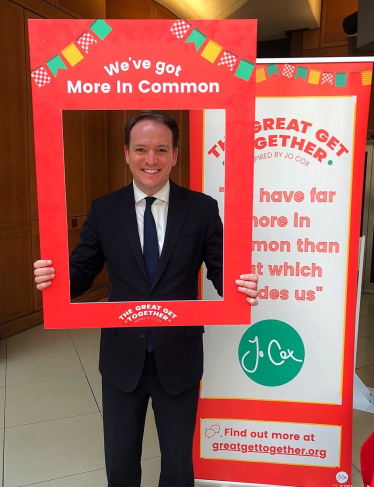 Gareth holding a placard