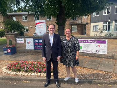 Gareth Davies MP and Marie outside Gregory House